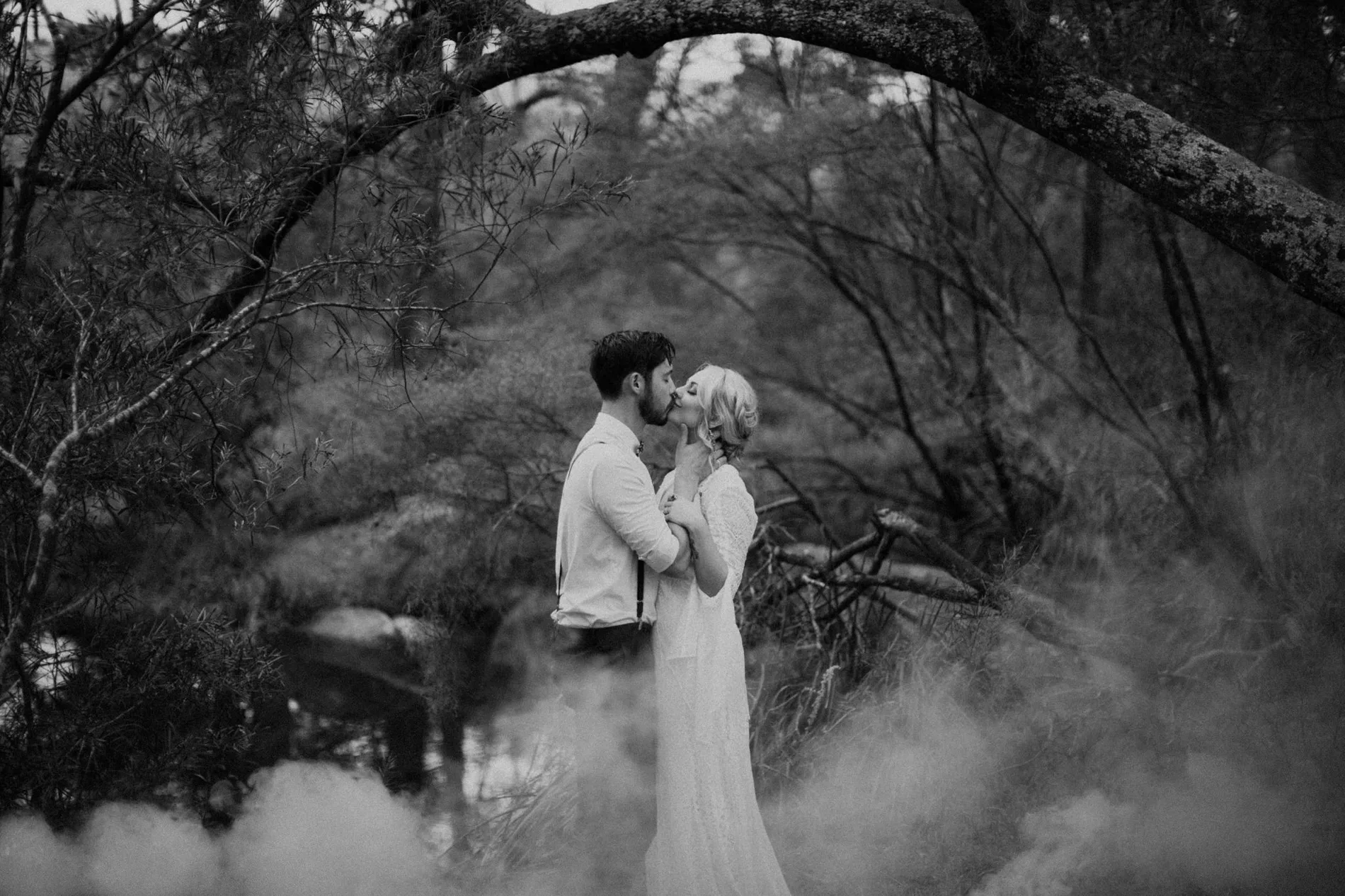 Black and white frame of a couple in deep mist