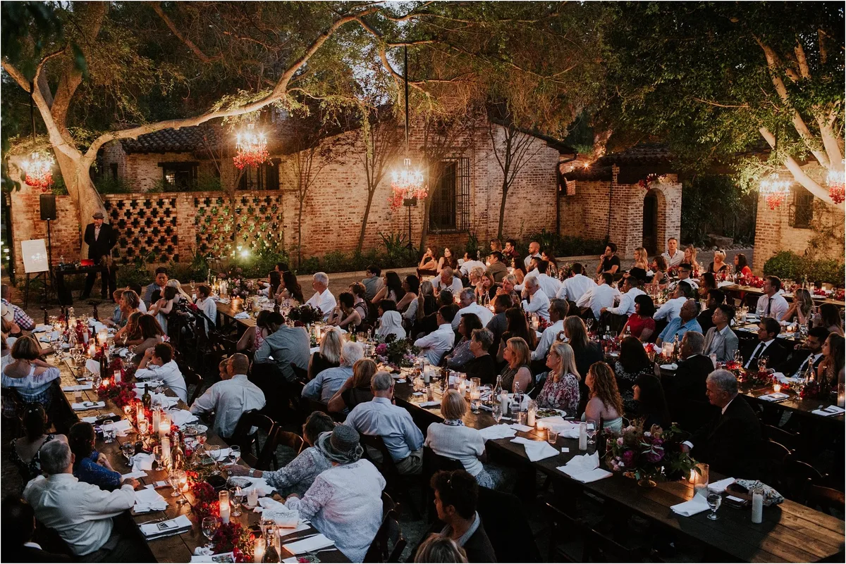 A long table reception under festoon lights